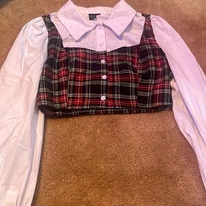 This is a plaid shirt with a white undershirt sewn into it